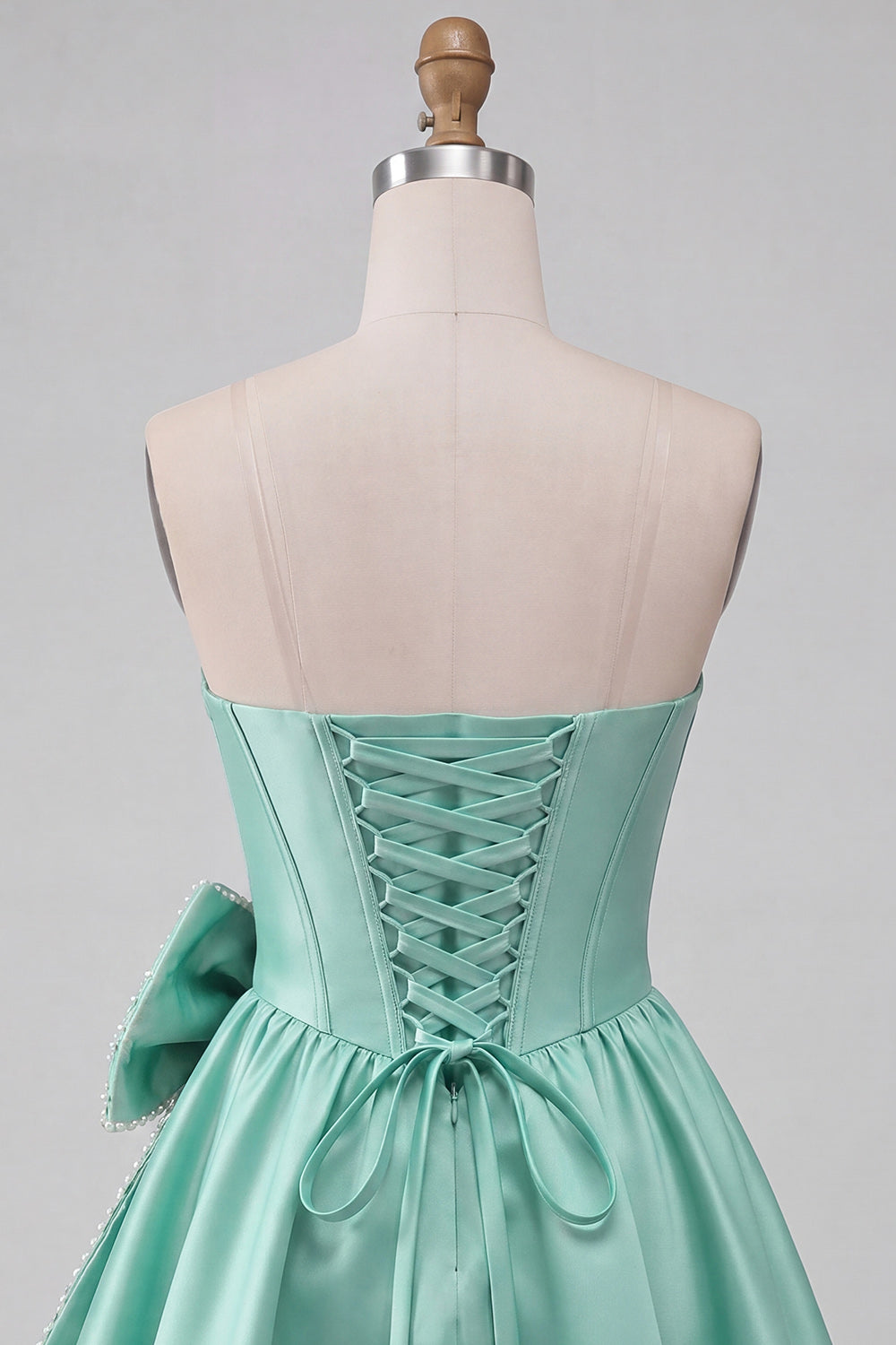 A-Line Mint Green Satin Strapless Lace Up Back Pearl Corset Homecoming Dress with Bow